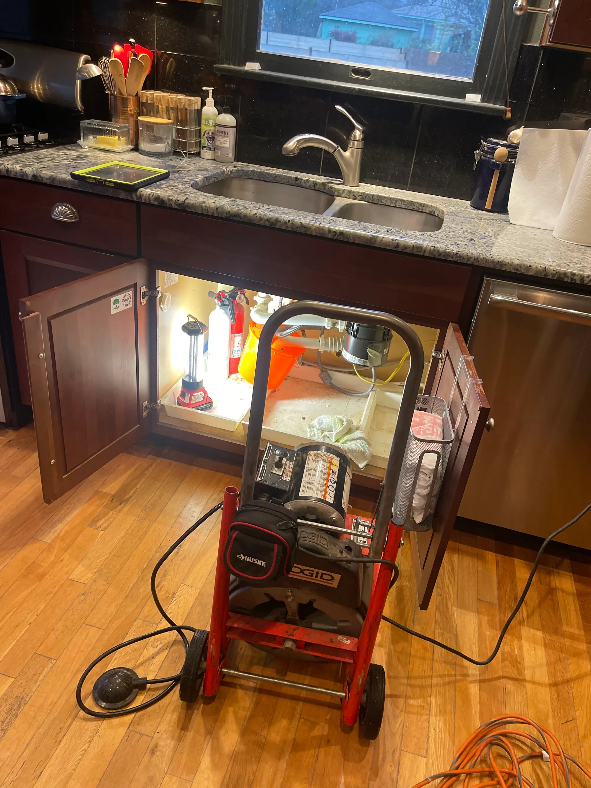 Round Rock plumber clearing a clogged residential drain