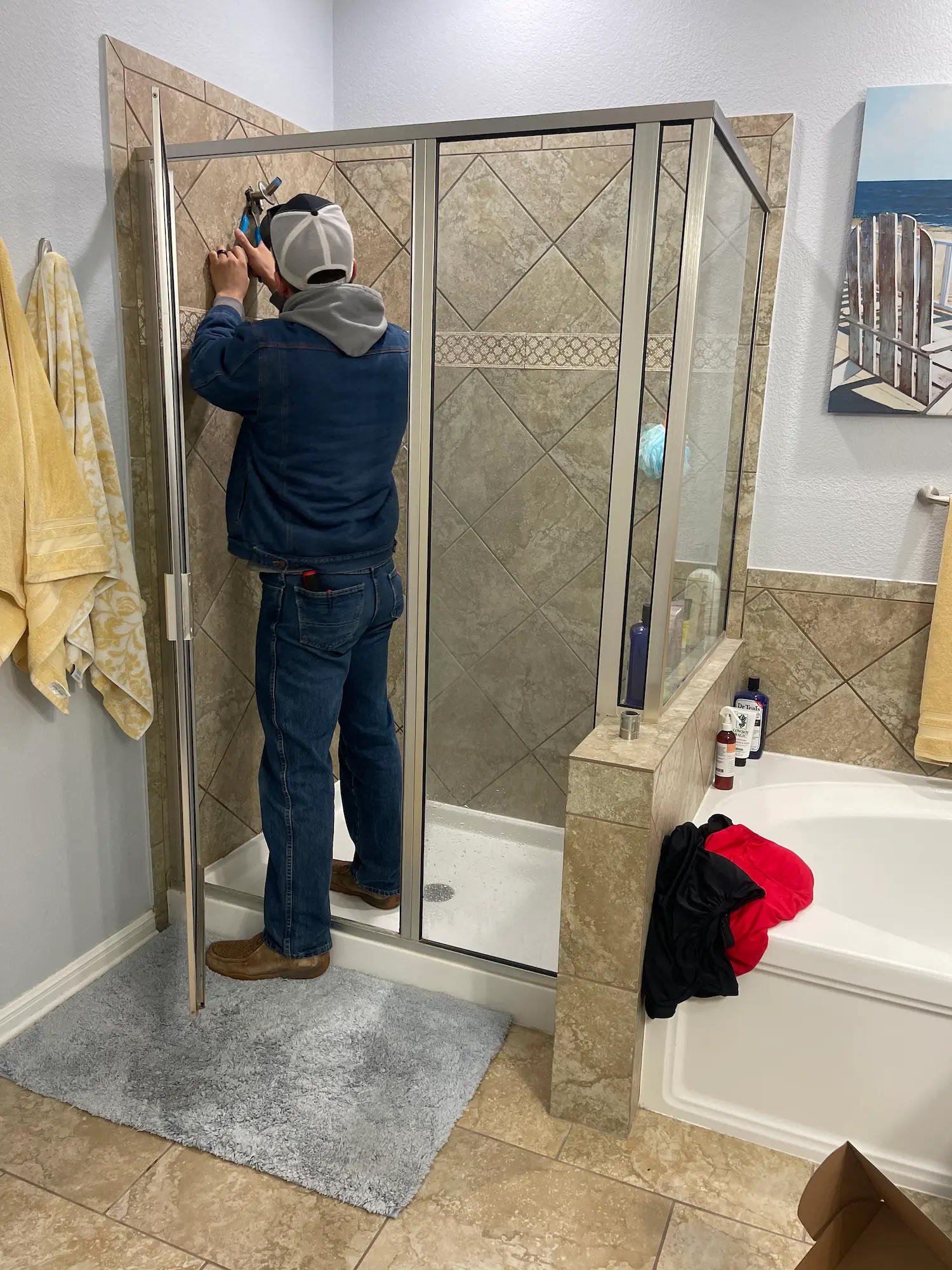 Residential plumbing services in Round Rock TX - licensed plumber repairing shower and bathroom fixtures